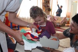 Vera receiving her doll